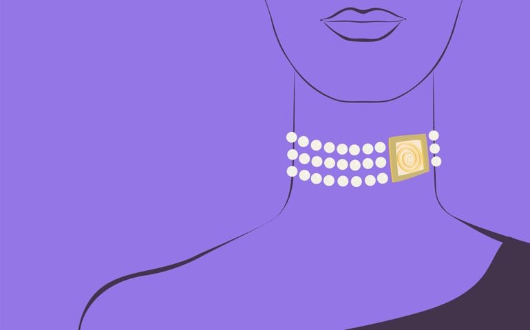 Fashion portrait of a woman with a pearl necklace on her neck on a colored background