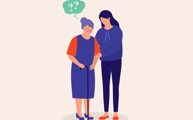 Young Daughter Taking Care Of Her Elderly Mother With Dementia Or Amnesia