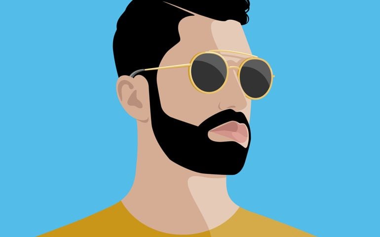 Portrait of handsome young bearded hipster man with serious expression wearing golden sunglasses and yellow shirt against blue sky background