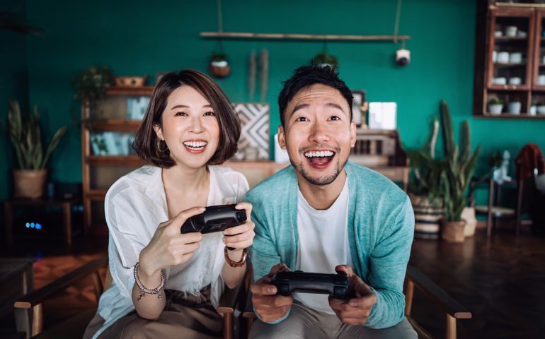 Happy young couple sitting on the sofa in the living room,
