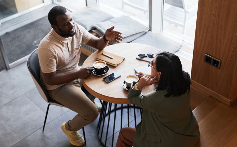 Two Business People in Cafe High Angle