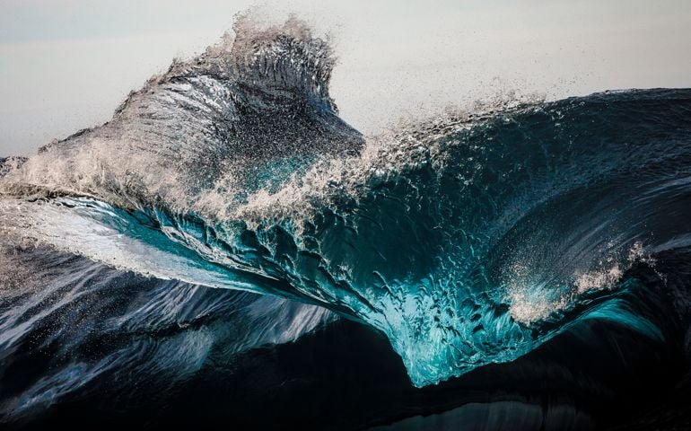 Extreme close up of thrashing emerald ocean waves