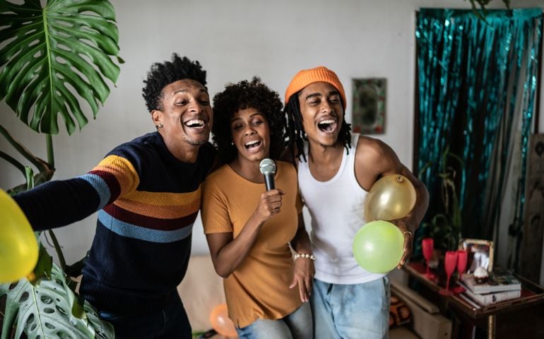 Friends singing together at home