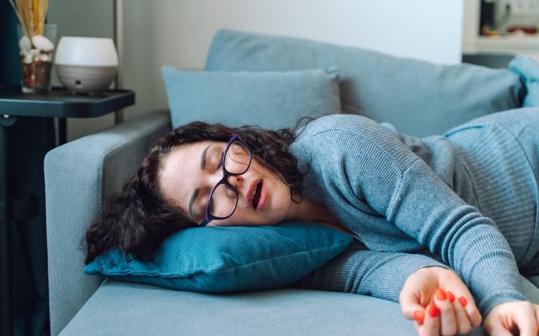 Woman sleep at home on a sofa