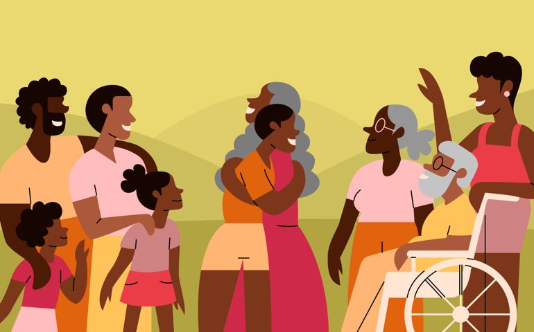 A family and friends get together for family reunion outside in park to celebrate