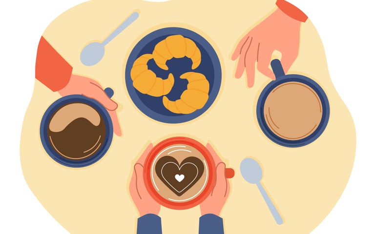People drink coffee in cafe. Morning breakfast. Hands holding cups of hot drinks and eating croissants