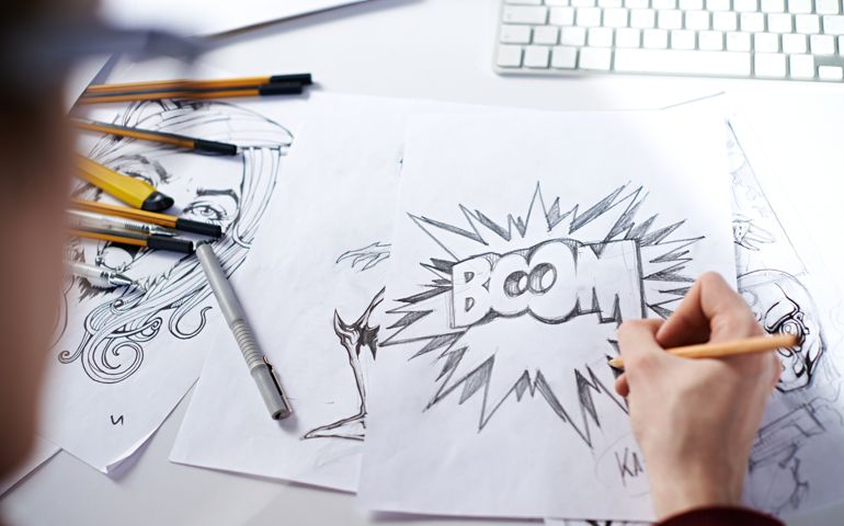 Artist drawing picture with word: "Boom!"