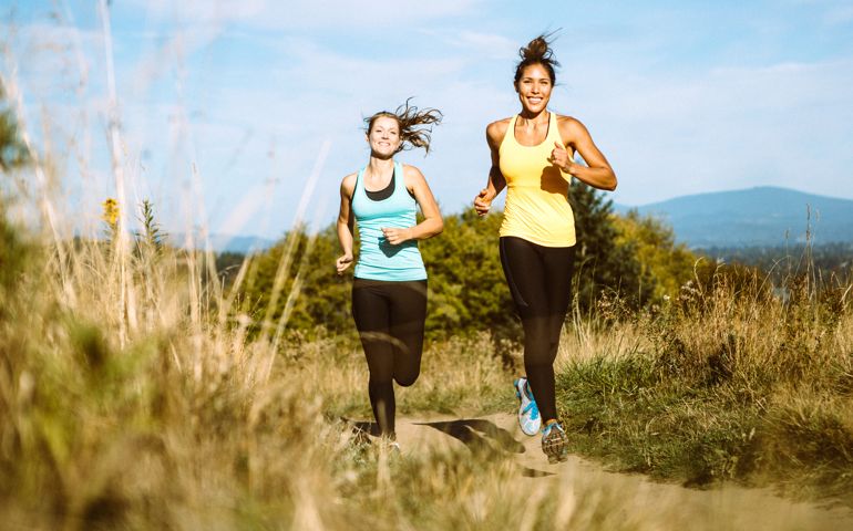 Friends Jogging in Nature Area