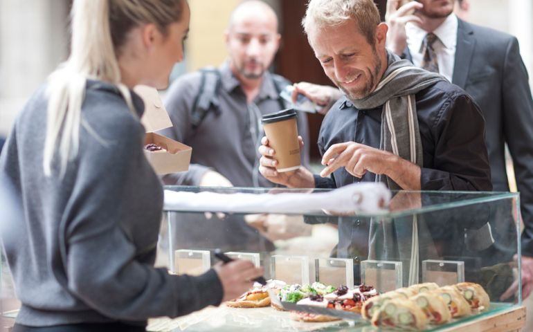 Man buying food at city market