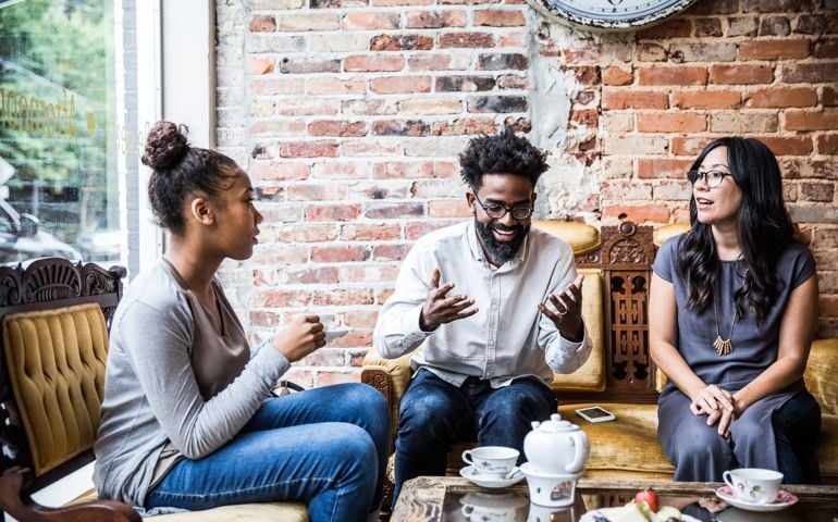 Group of friends enjoying tea at cool teashop