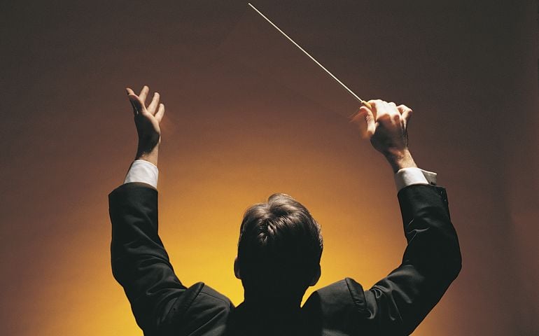 Music conductor with baton