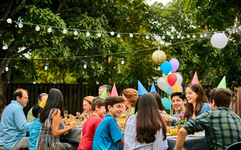 Multi-generation family celebrating birthday party