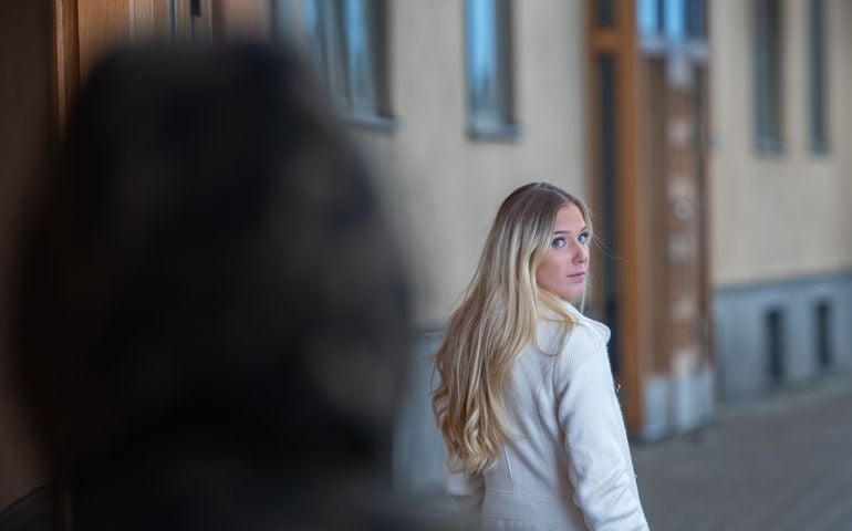 Worried young woman being followed