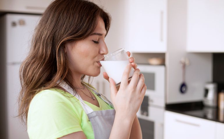 young woman drinking milk