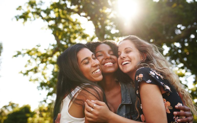 happy friends hugging