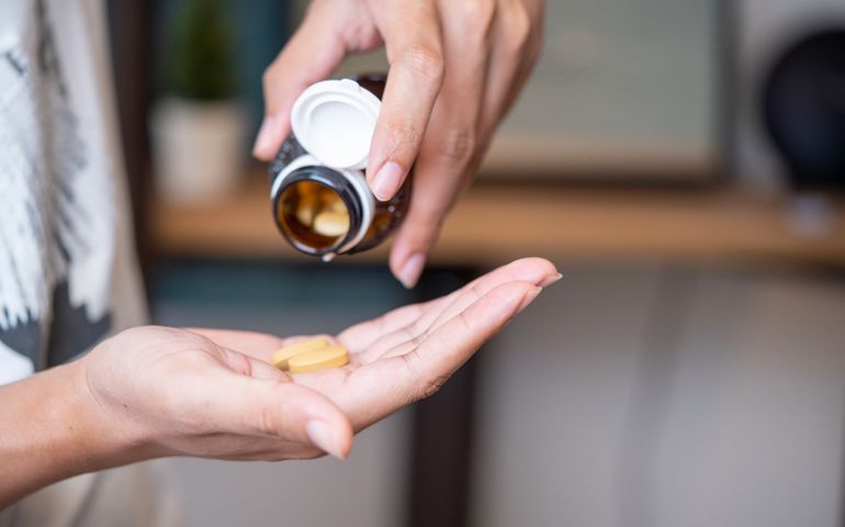 Man taking vitamins and supplements