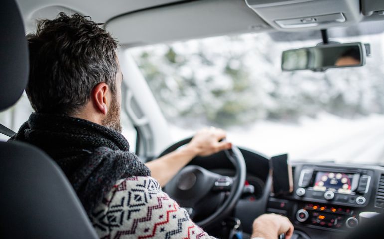 man driving in the snow