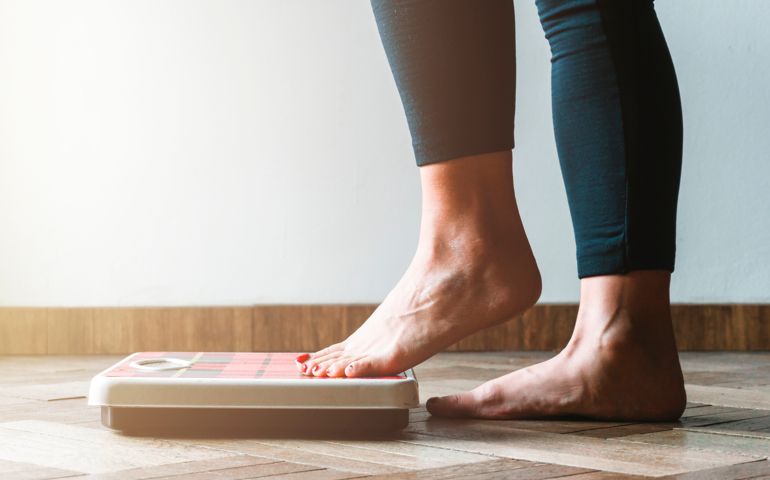 woman weighing herself