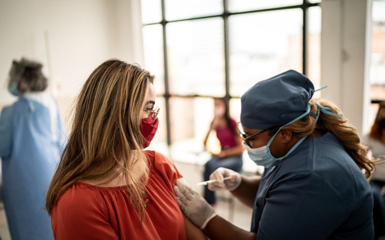 woman being vaccinated