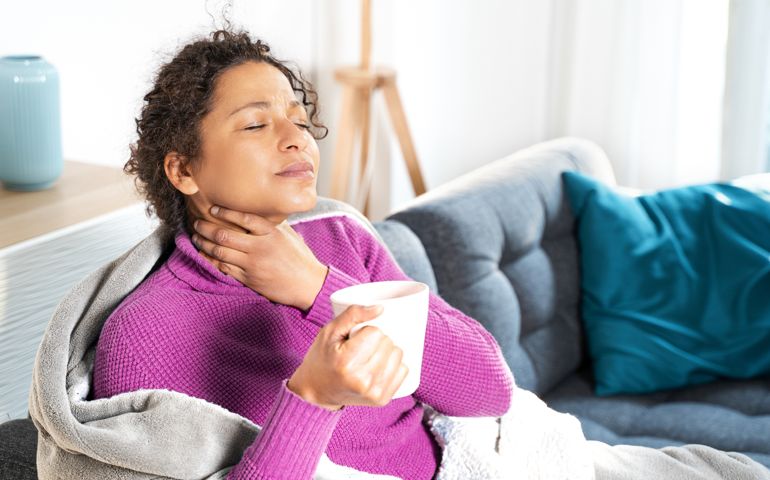 woman with a sore throat