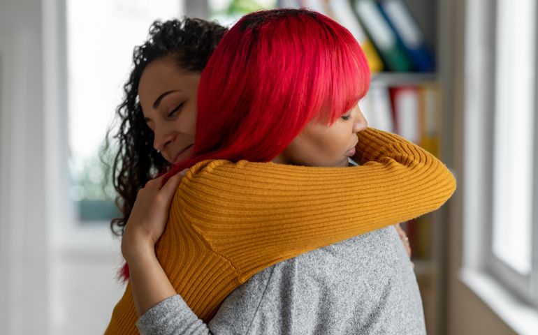 woman hugging each other