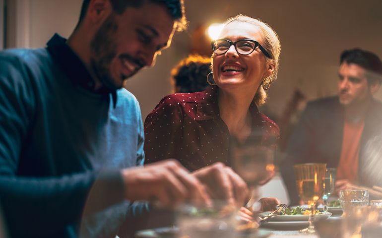 Group Of Friends Having Fun During A Dinner Celebration