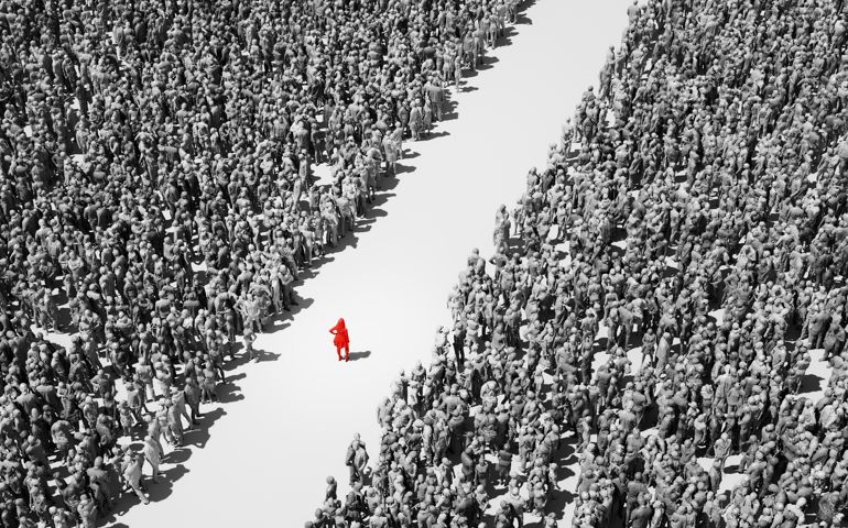 Woman standing in crowds of people