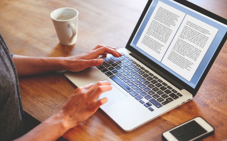 person writing a book