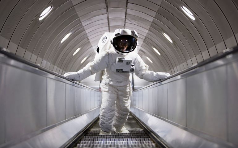 Astronaut using an escalator