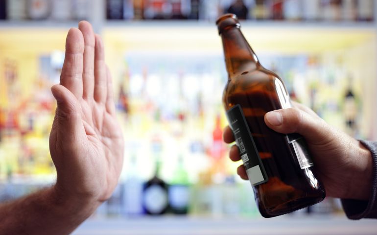 Hand rejecting alcoholic beer beverage