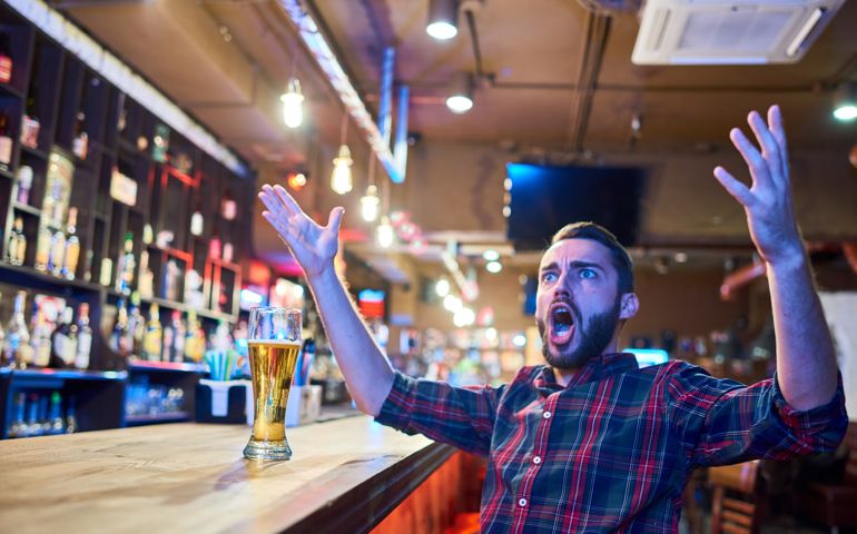 Emotional Sports Fan in Pub