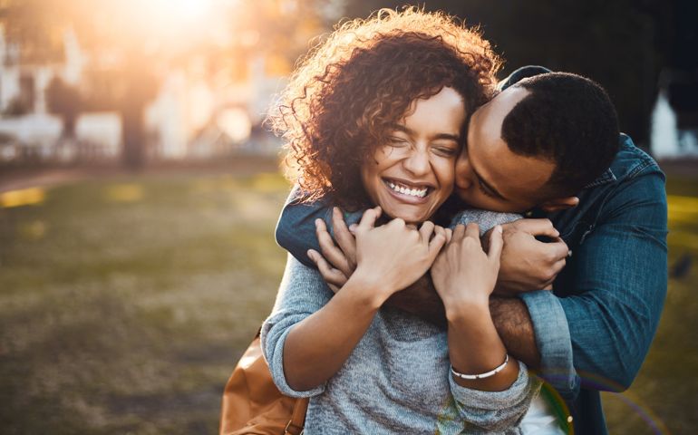 woman given a kiss
