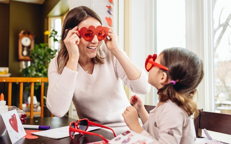 Mother and young daughter crafting for Valentine's Day