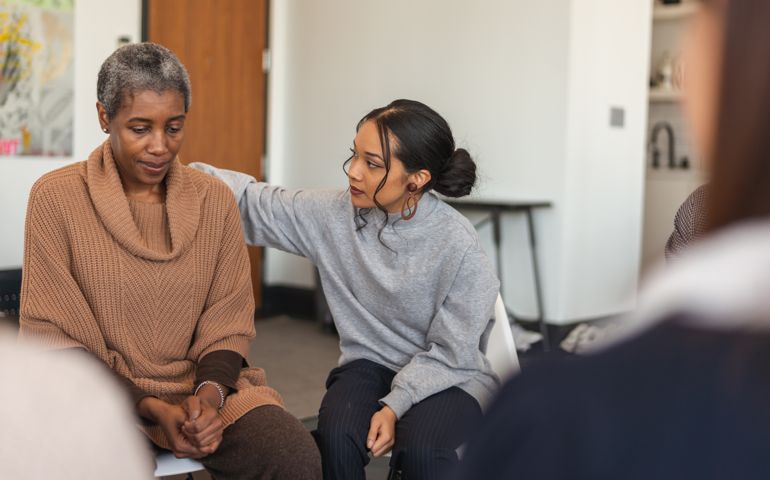 Young woman shows support in therapy session