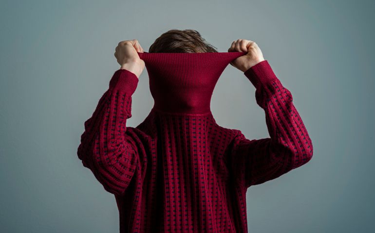 person hiding under turtle neck