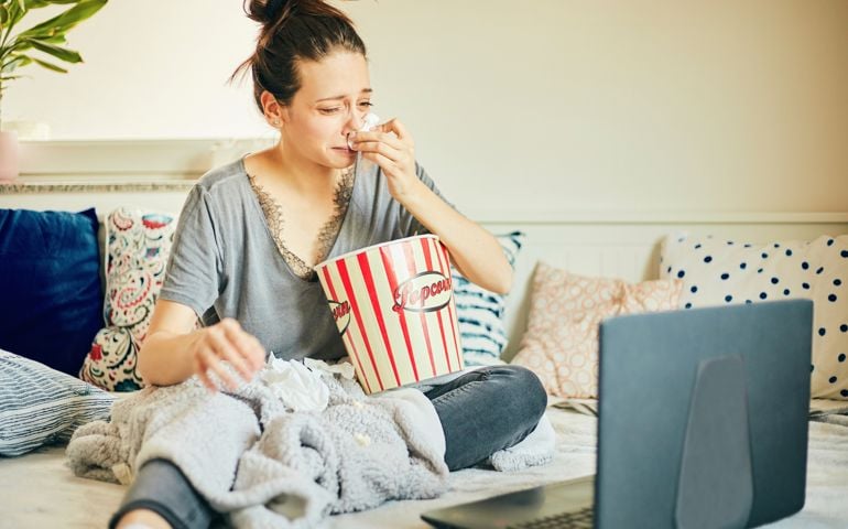 woman watching movie at home.