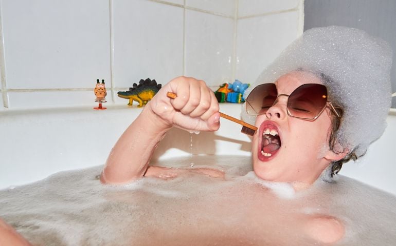 Child singing in bubble bath