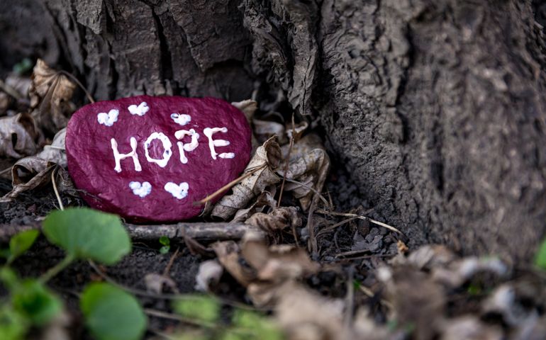 Painted rock that says, "Hope"