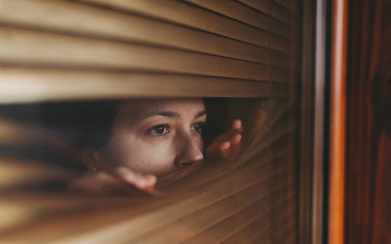 woman looking outside