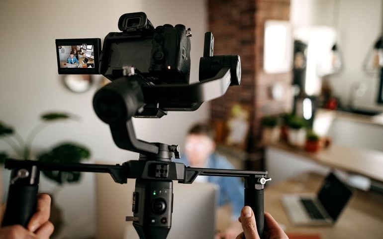 Cameraman recording with his equipment
