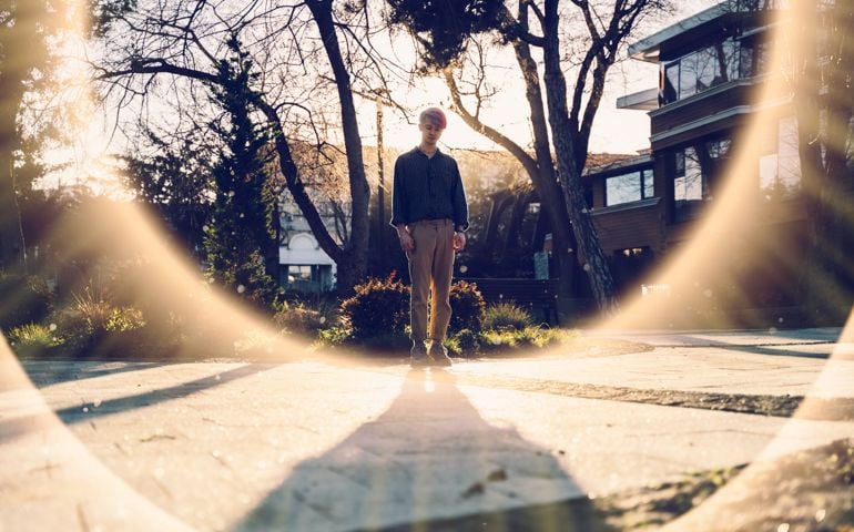 A silhouette of a dancer in the sunrays and lens flare
