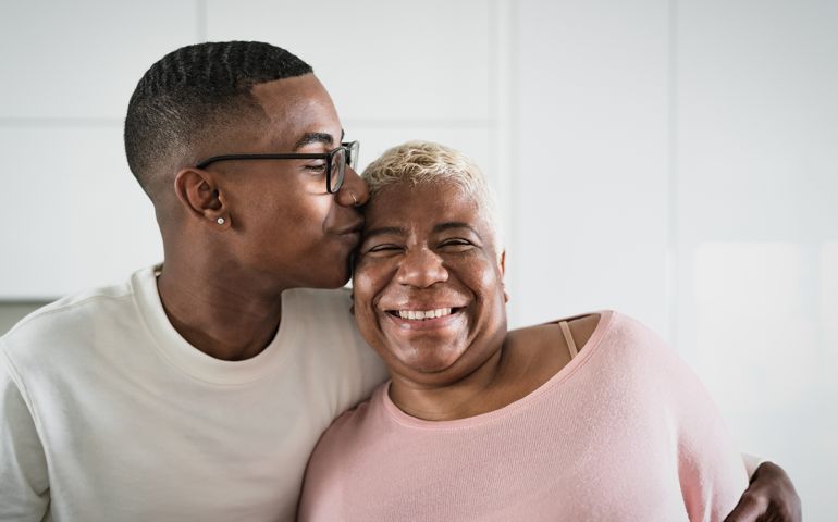 Happy Hispanic mother and son portrait