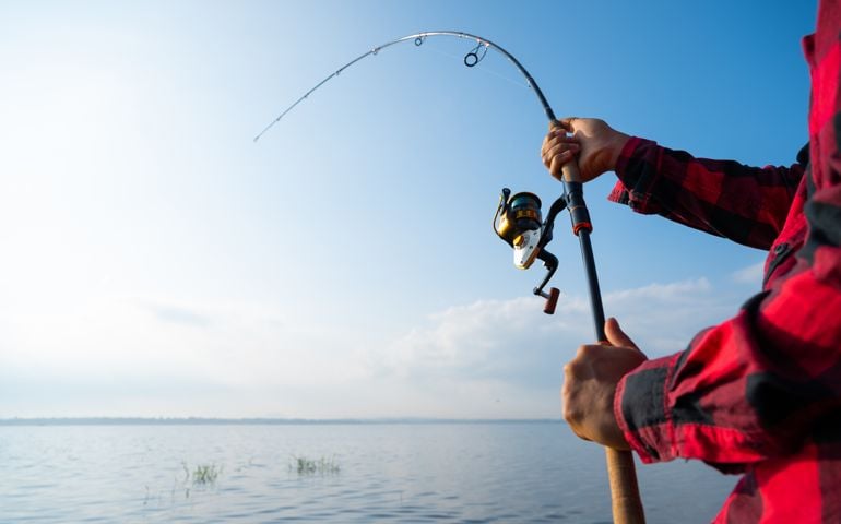 Closeup man fishing in the lake