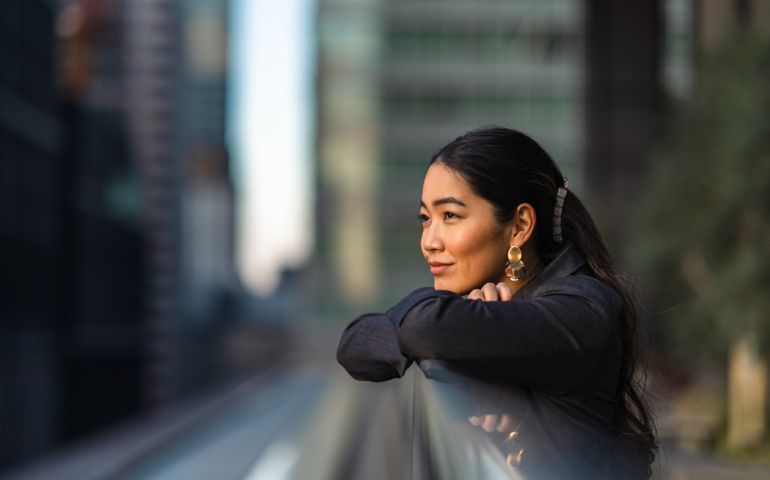 Portrait of beautiful businesswoman in city