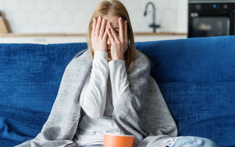 scared woman watching tv
