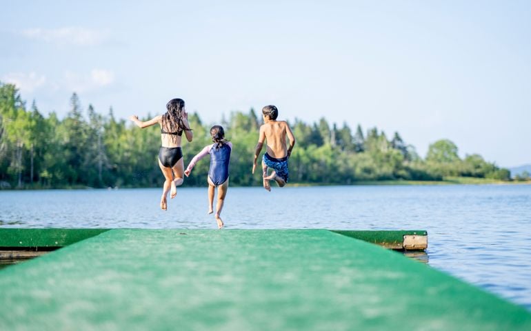 Children Running off a Dock