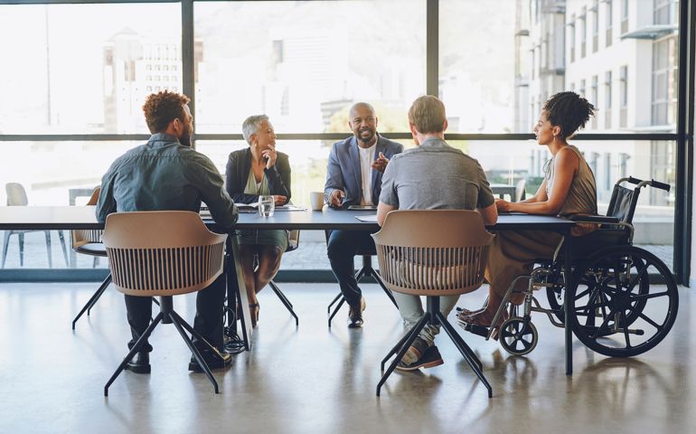 people sitting at meeting table