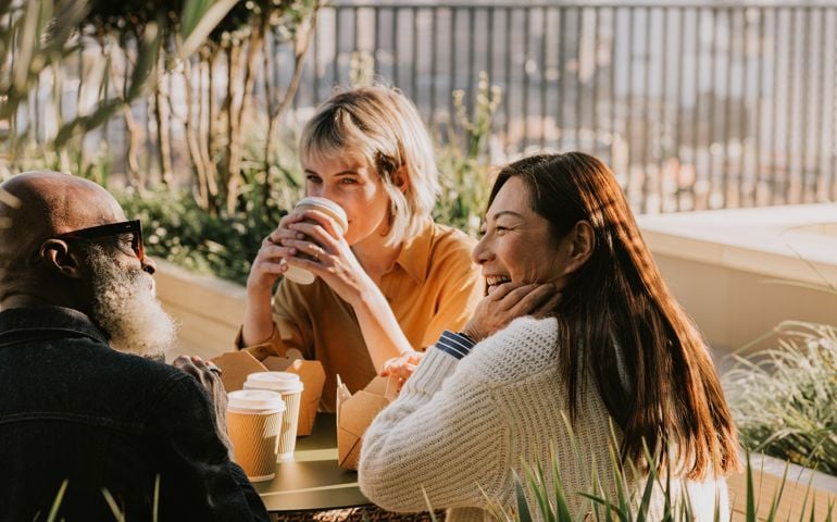 A group of coworkers enjoy an alfresco lunch
