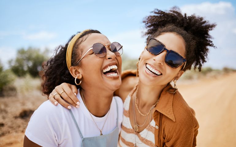 friends hugging and laughing