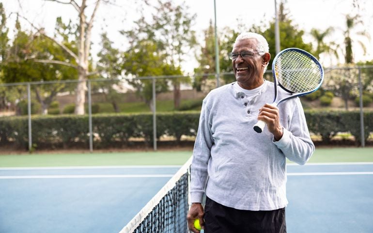 senior black man on the tennis court